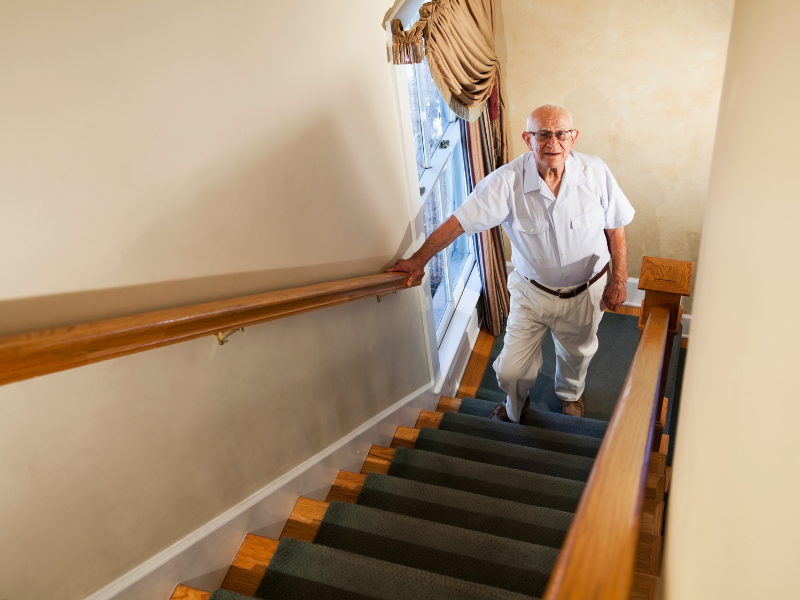 Old man is climbing on stairs